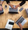 Team working around laptops. Key recruitment strategies.